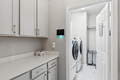 a utility room with cabinets