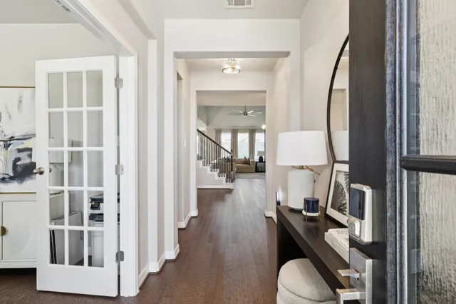 a view of a livingroom with furniture and hardwood floor