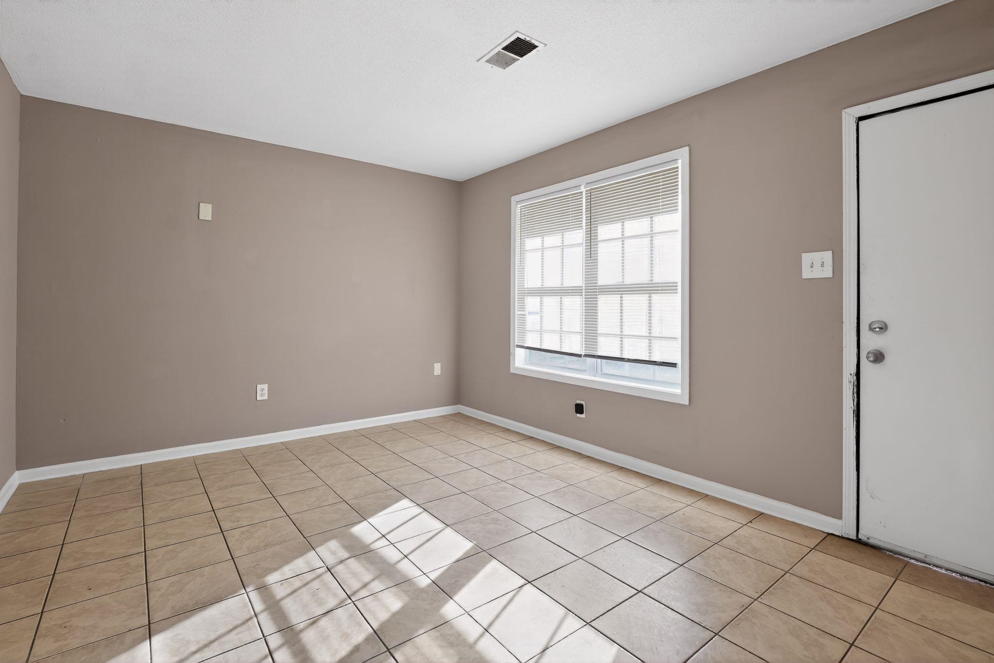 4306 University Street Memphis, TN 38127 - Photo 6 of 26 Unfurnished room featuring baseboards and light tile patterned flooring