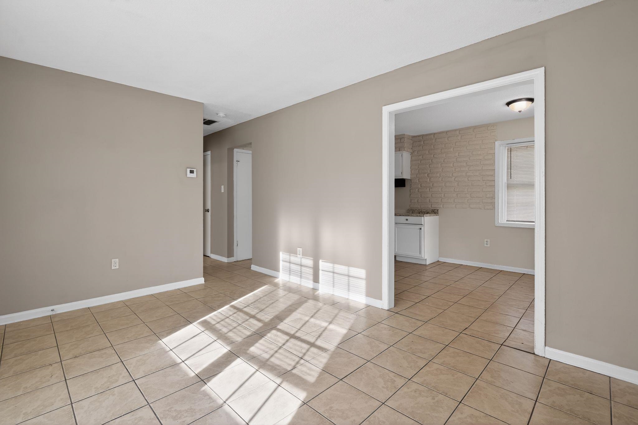 4306 University Street Memphis, TN 38127 - Photo 7 of 26 Empty room with light tile patterned floors and baseboards