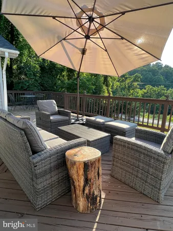 swimming pool view with a seating space