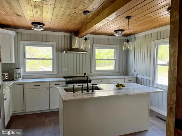a room with wooden furniture and window