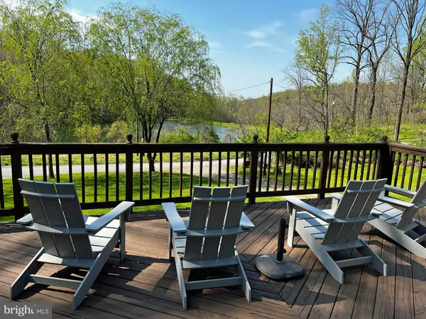 a view of a chairs and table on the deck