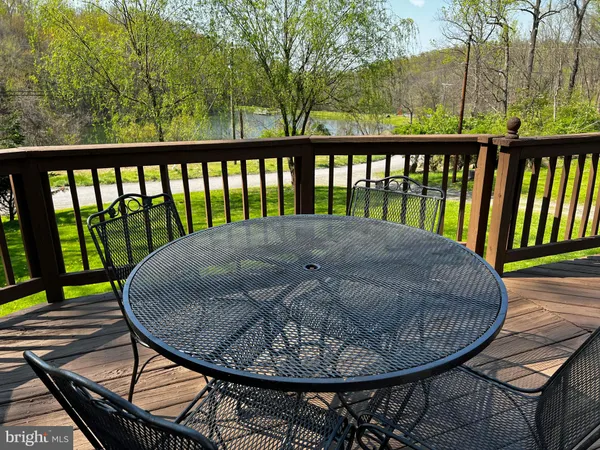 a view of a balcony with wooden floor