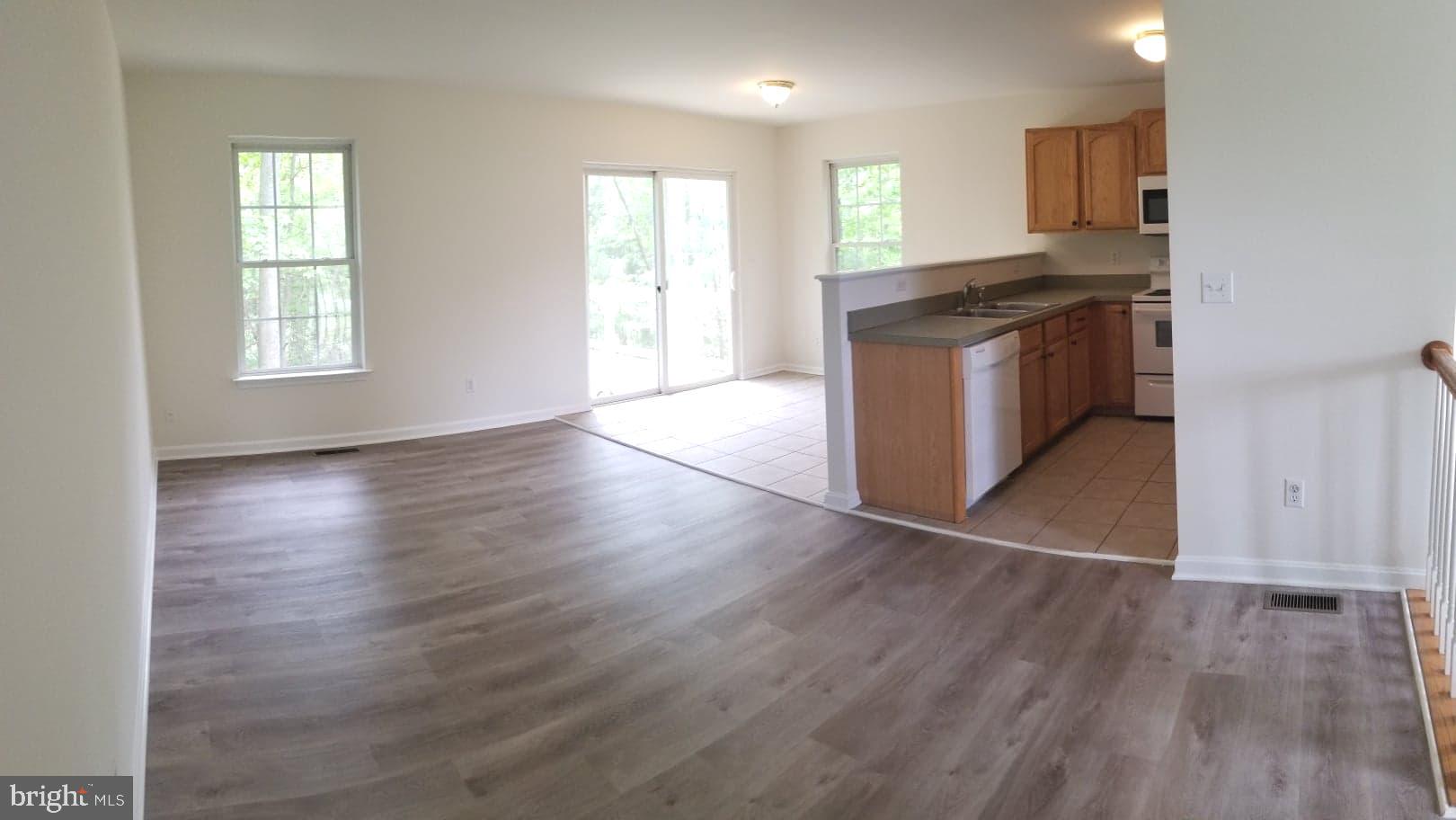 109 Collier Road Grasonville, MD 21638 - Photo 7 of 17 Sitting Room looking into Dining Area and Kitchen
