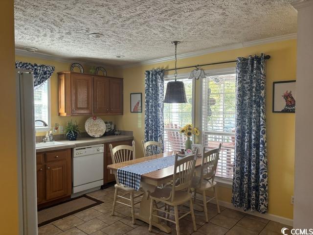 449 East Bank Dr Garden Murrells Inlet, SC 29576 - Photo 21 of 31 Dining area with baseboards, ornamental molding, and a textured ceiling