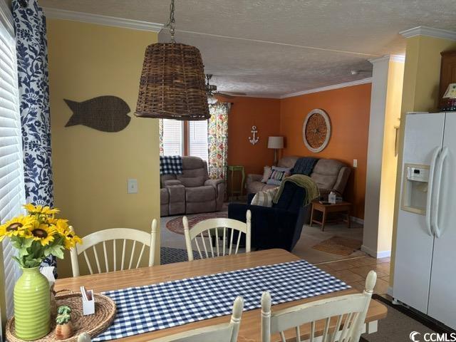 449 East Bank Dr Garden Murrells Inlet, SC 29576 - Photo 22 of 31 Dining area with a textured ceiling, baseboards, and crown molding