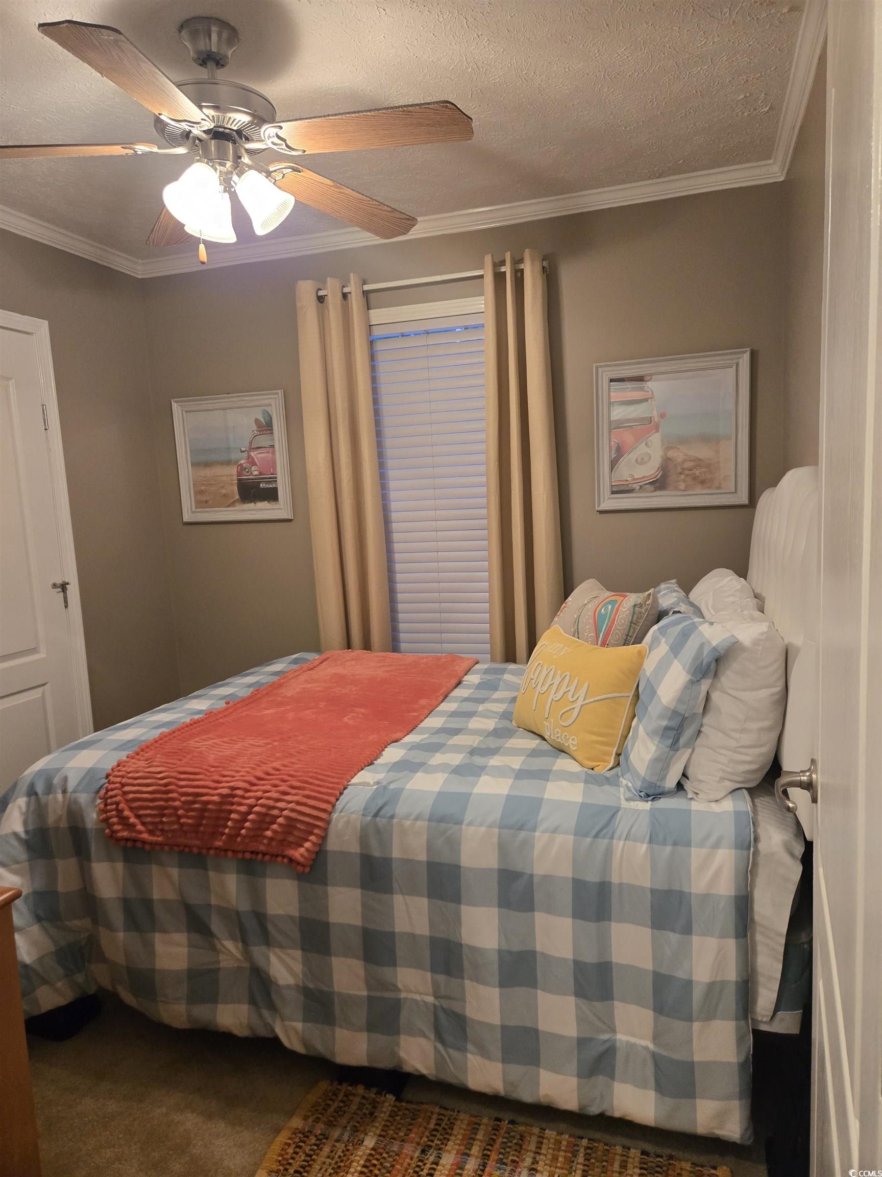 449 East Bank Dr Garden Murrells Inlet, SC 29576 - Photo 28 of 31 Bedroom with a ceiling fan, carpet, crown molding, and a textured ceiling