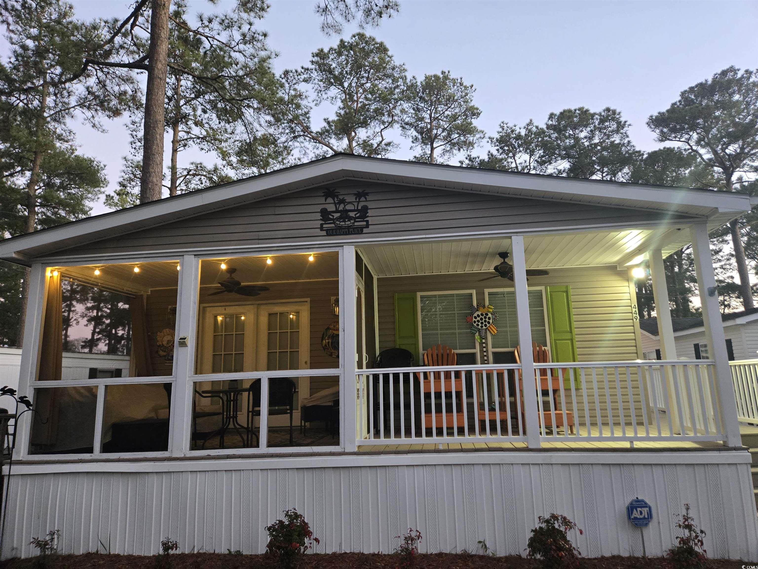 449 East Bank Dr Garden Murrells Inlet, SC 29576 - Photo 3 of 31 Exterior space with a sunroom and ceiling fan