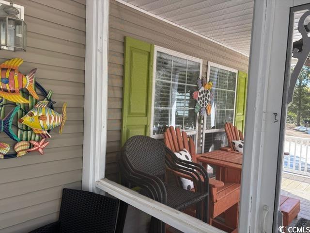 449 East Bank Dr Garden Murrells Inlet, SC 29576 - Photo 7 of 31 Wooden terrace featuring covered porch