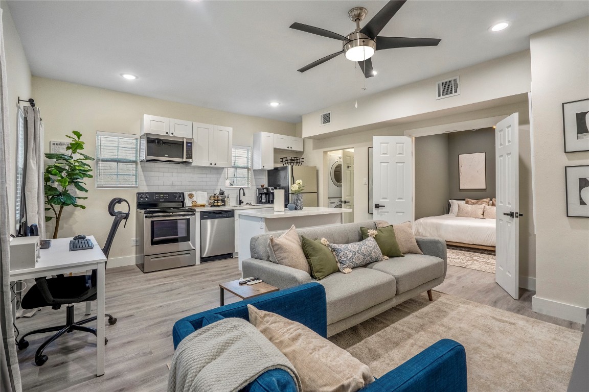 5 Estelle Street, Unit 1 Houston, TX 77003 - Photo 12 of 33 a living room with furniture and a view of kitchen