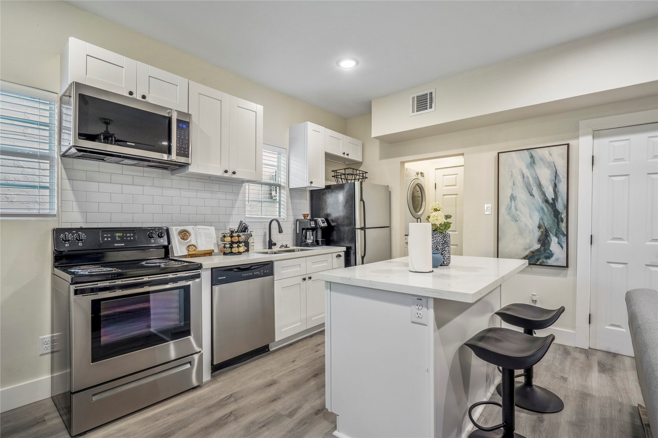 5 Estelle Street, Unit 1 Houston, TX 77003 - Photo 13 of 33 a kitchen with a stove a sink and a microwave