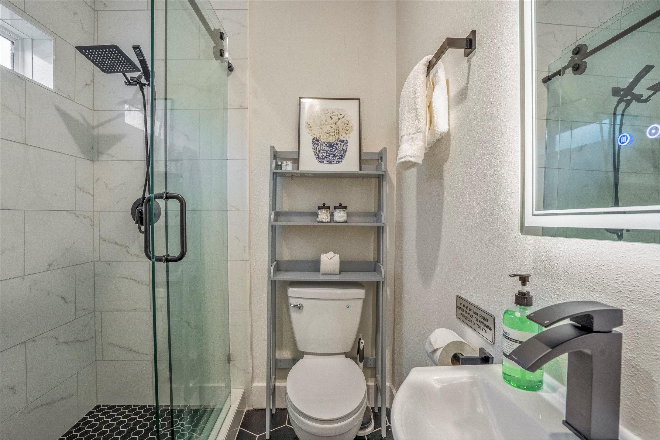 5 Estelle Street, Unit 1 Houston, TX 77003 - Photo 15 of 33 a bathroom with a toilet and a shower