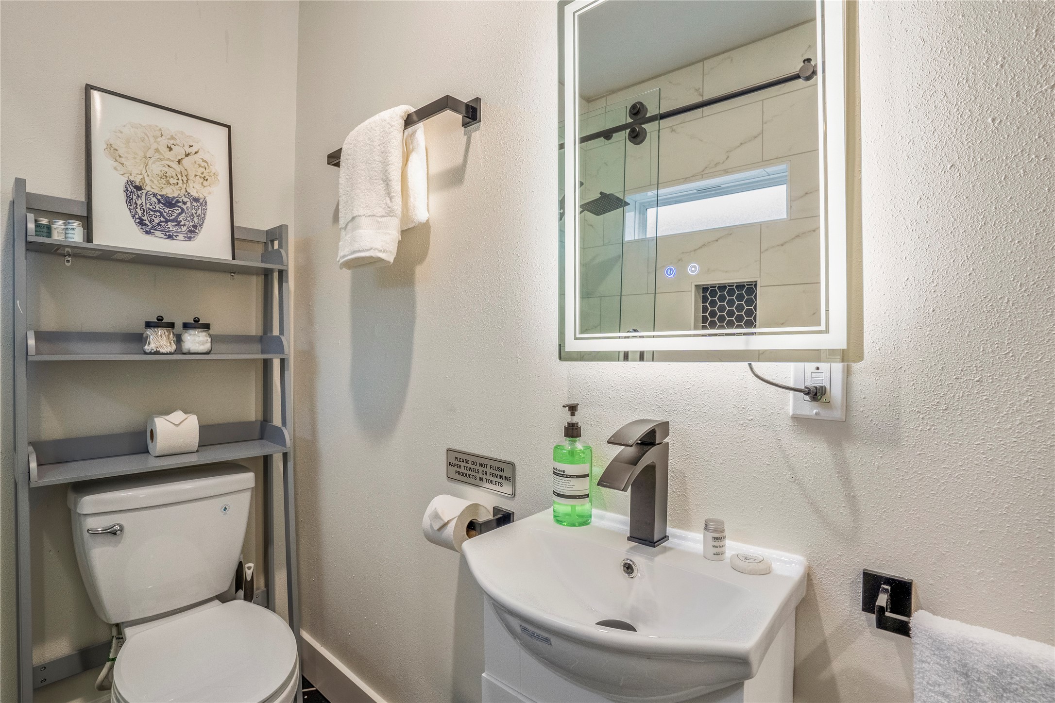 5 Estelle Street, Unit 1 Houston, TX 77003 - Photo 16 of 33 a bathroom with a toilet sink and shower