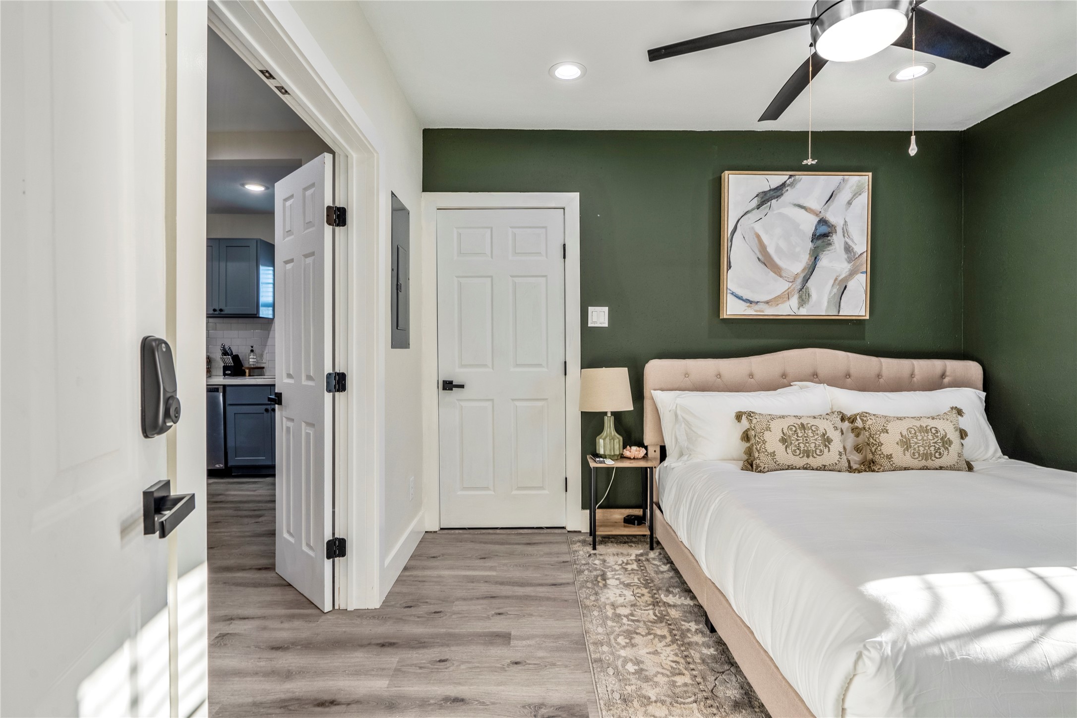 5 Estelle Street, Unit 1 Houston, TX 77003 - Photo 18 of 33 a bedroom with a bed and a painting