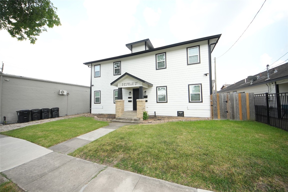 5 Estelle Street, Unit 1 Houston, TX 77003 - Photo 2 of 33 a front view of a house with a yard and garage