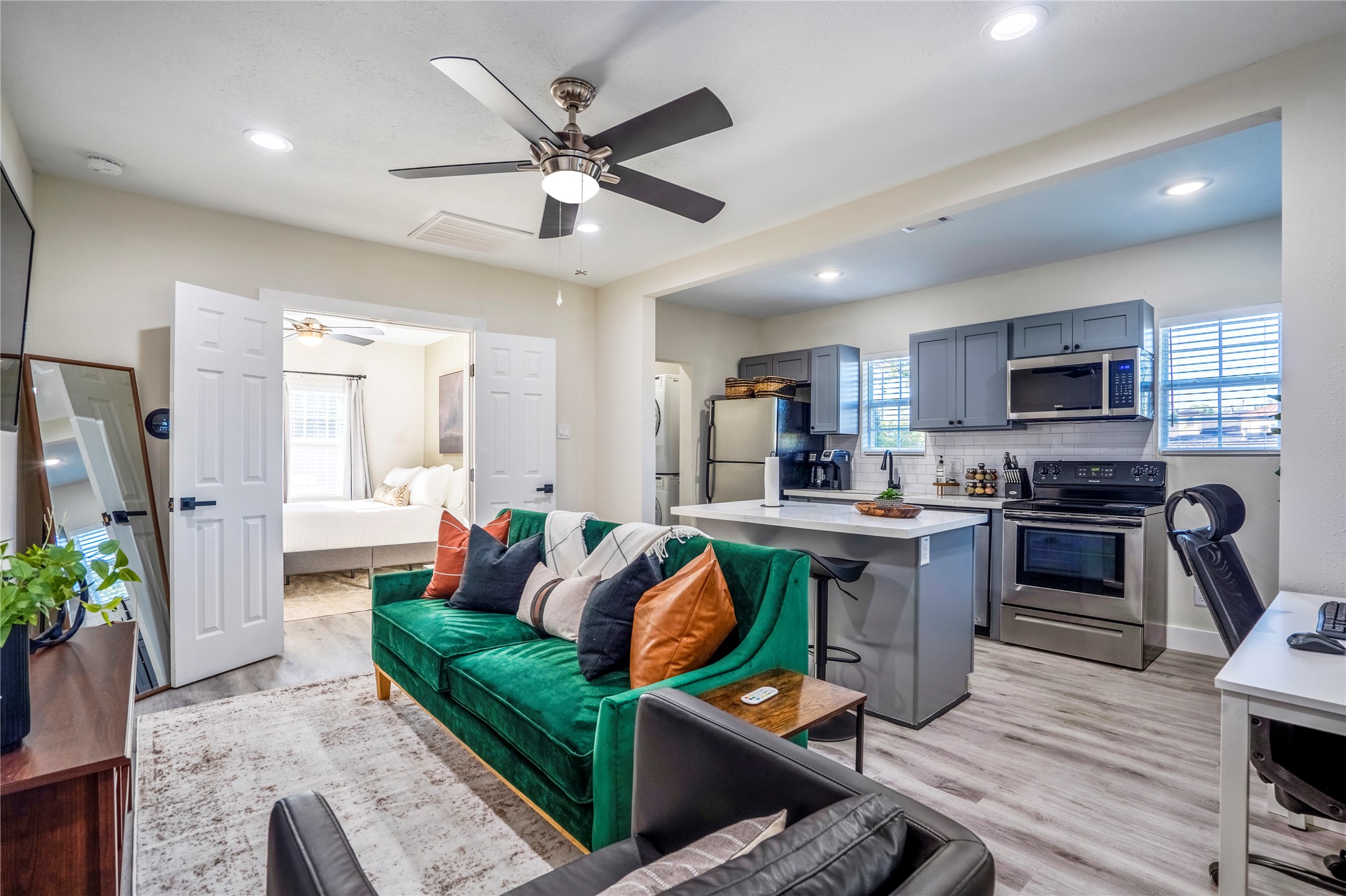5 Estelle Street, Unit 1 Houston, TX 77003 - Photo 25 of 33 a living room with stainless steel appliances furniture and a view of kitchen