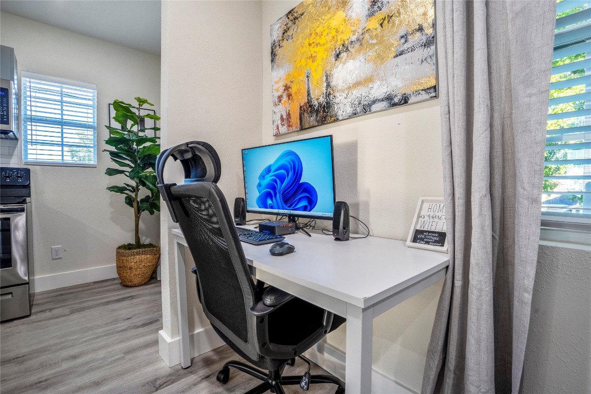 5 Estelle Street, Unit 1 Houston, TX 77003 - Photo 29 of 33 a view of a workspace with furniture and a potted plant