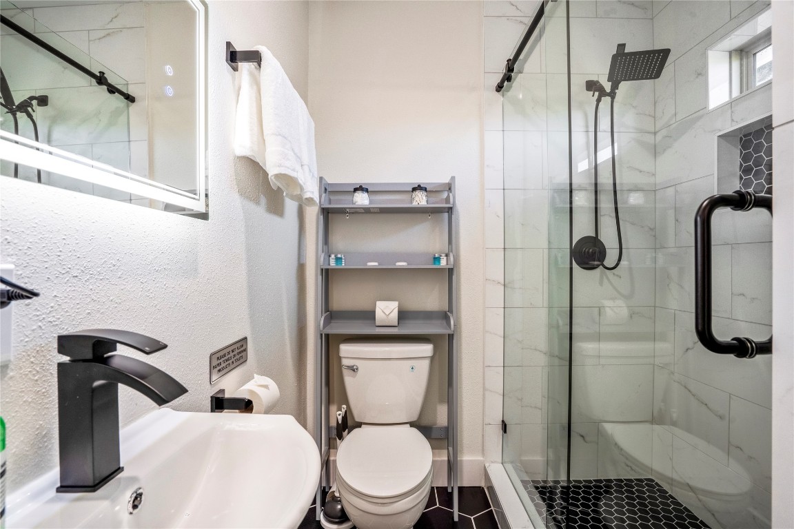 5 Estelle Street, Unit 1 Houston, TX 77003 - Photo 31 of 33 a bathroom with a toilet and a shower