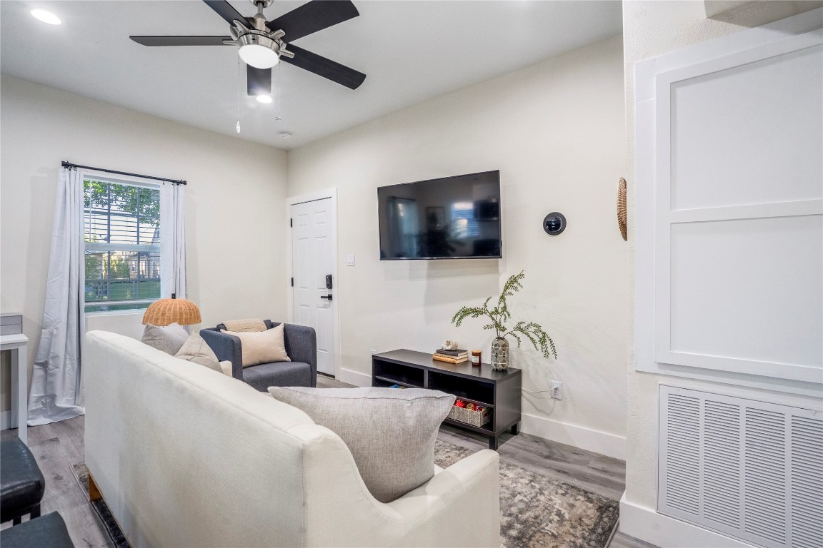 5 Estelle Street, Unit 1 Houston, TX 77003 - Photo 6 of 33 a living room with furniture and a flat screen tv