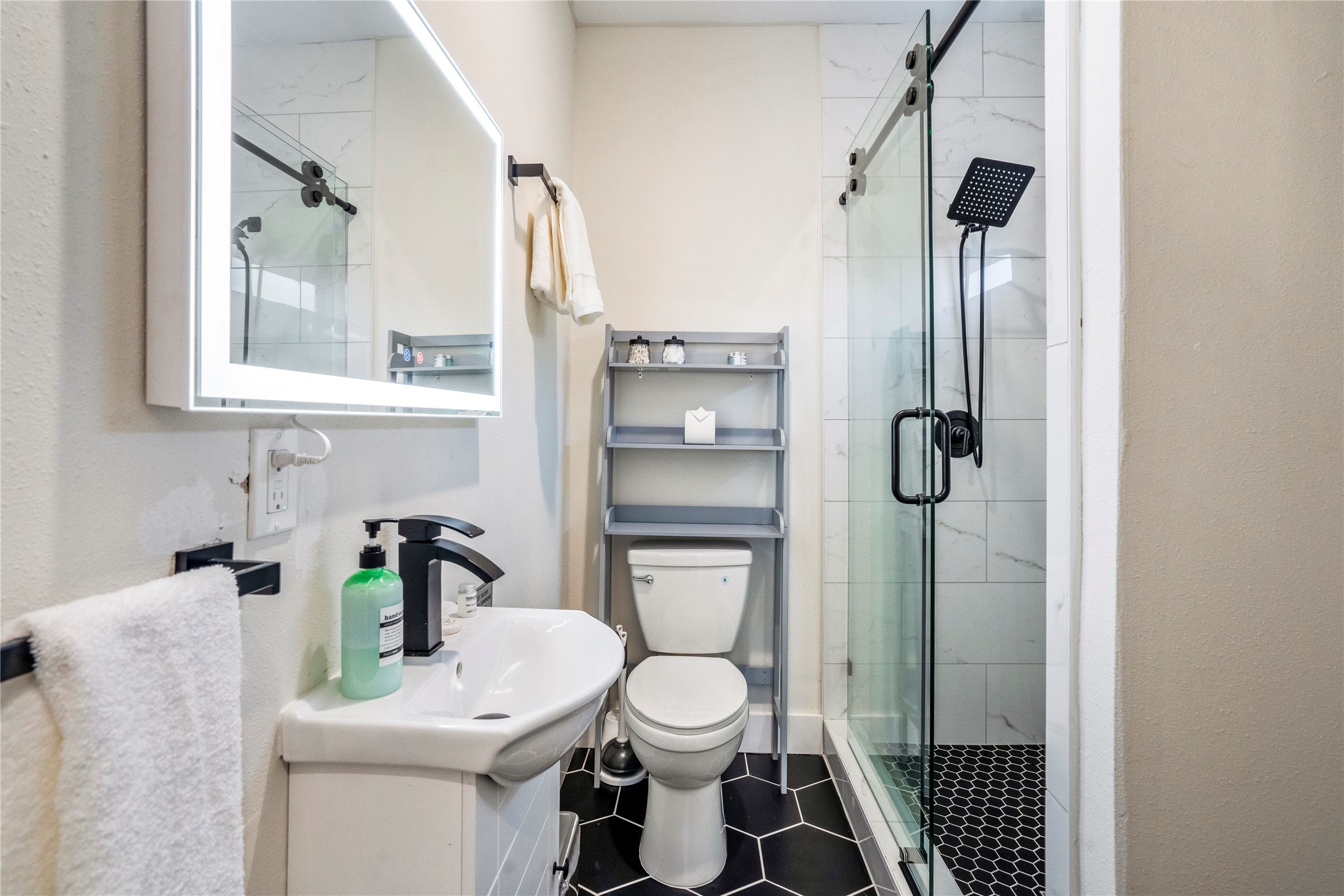 5 Estelle Street, Unit 1 Houston, TX 77003 - Photo 9 of 33 a bathroom with a toilet sink and shower