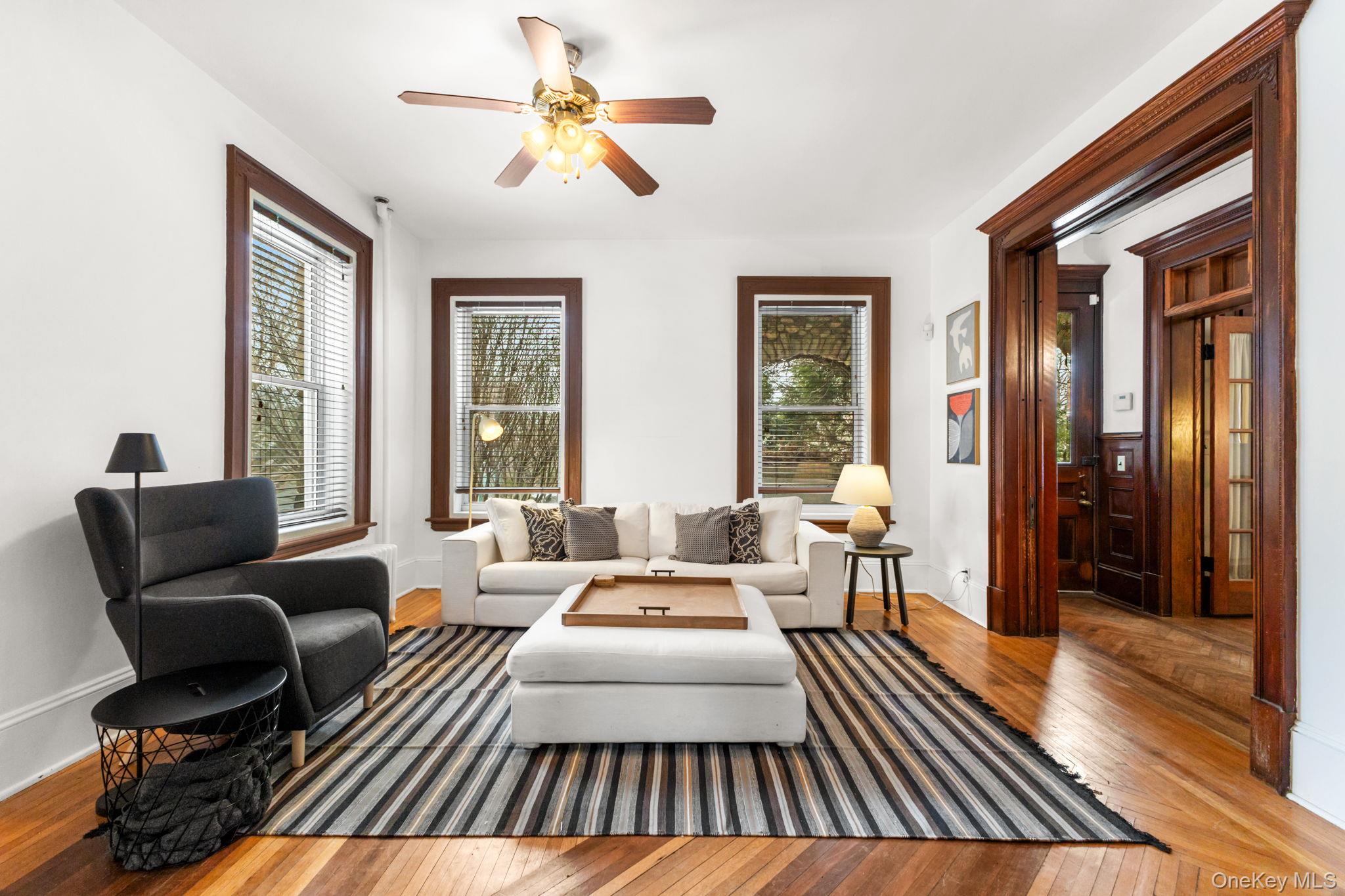 16 Bedford Road, Unit 1 Katonah, NY 10536 - Photo 2 of 13 a living room with furniture and a window
