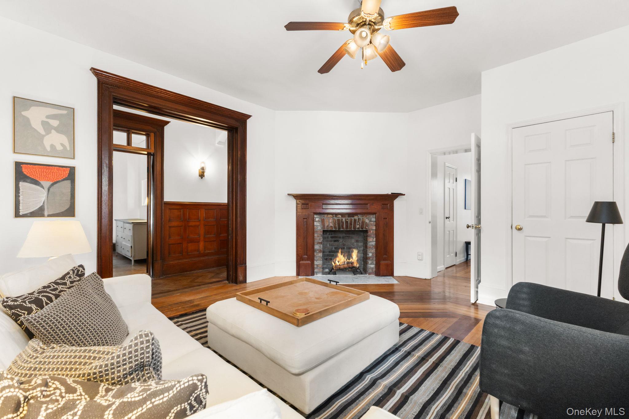 16 Bedford Road, Unit 1 Katonah, NY 10536 - Photo 3 of 13 a living room with furniture and a fireplace