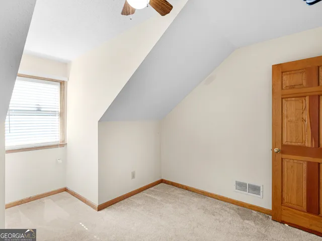 a view of a backyard with sitting area