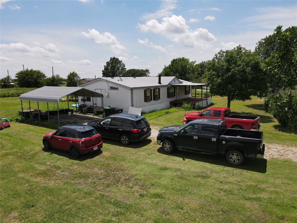 15962 Fritcher Road Pilot Point, TX 76258 - Photo 13 of 24 View of green lawn with a detached carport
