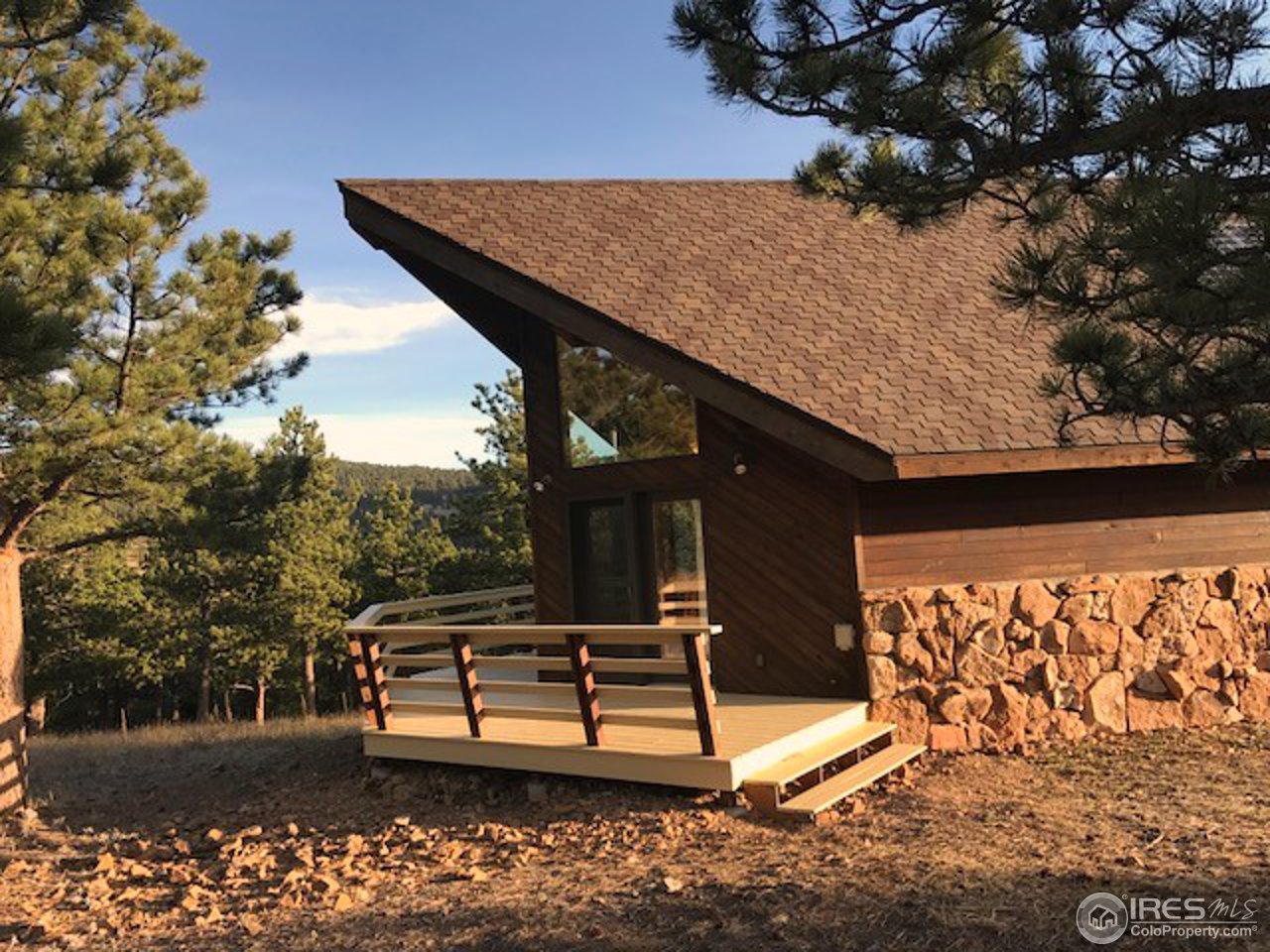 238 Valley Road Lyons, CO 80540 - Photo 1 of 28 a house view with a garden space