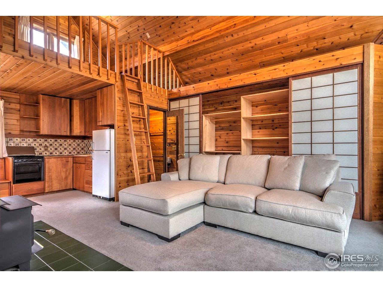 238 Valley Road Lyons, CO 80540 - Photo 13 of 28 a bedroom with furniture and a large window
