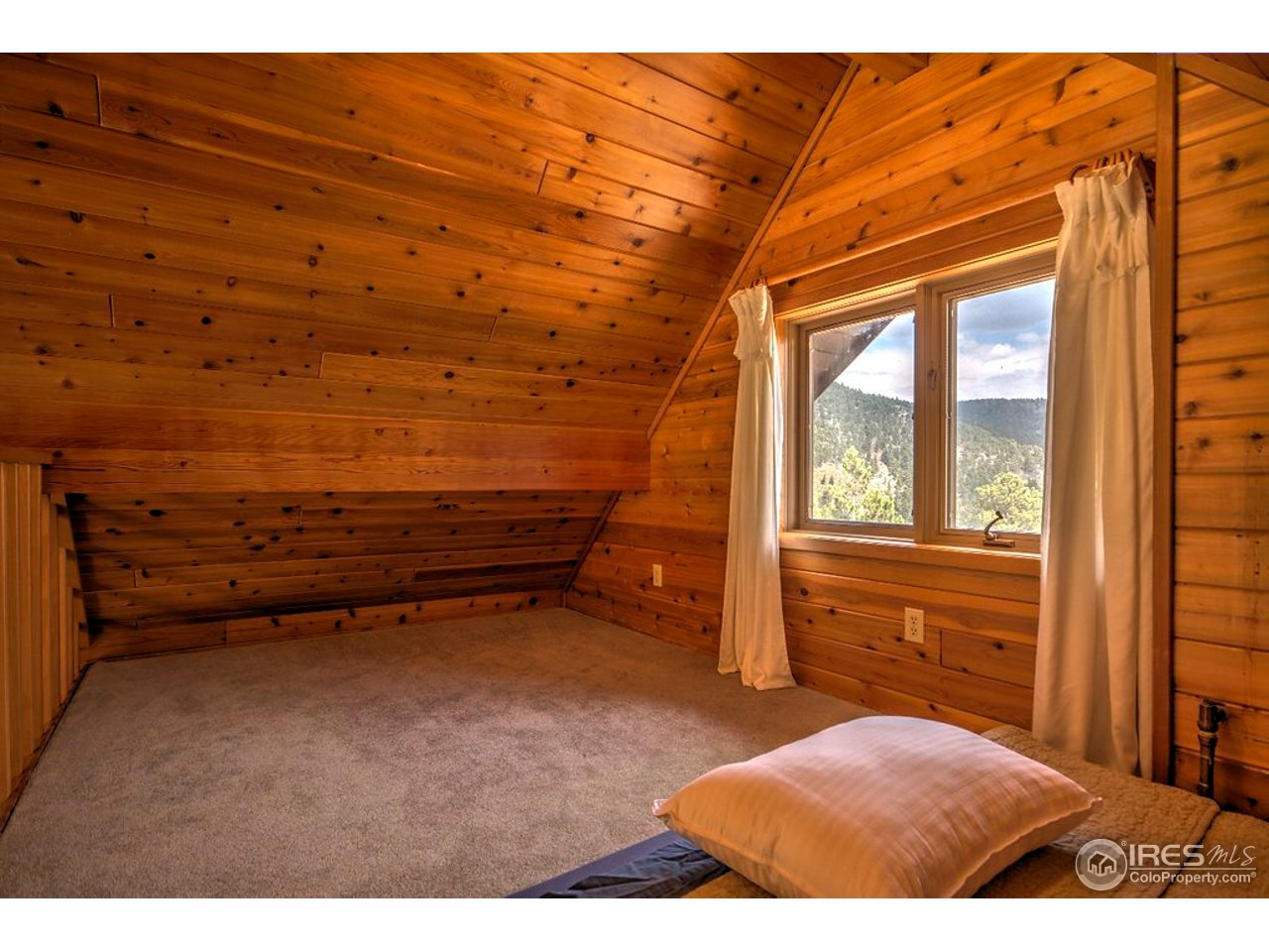 238 Valley Road Lyons, CO 80540 - Photo 20 of 28 a view of a room with furniture and a window