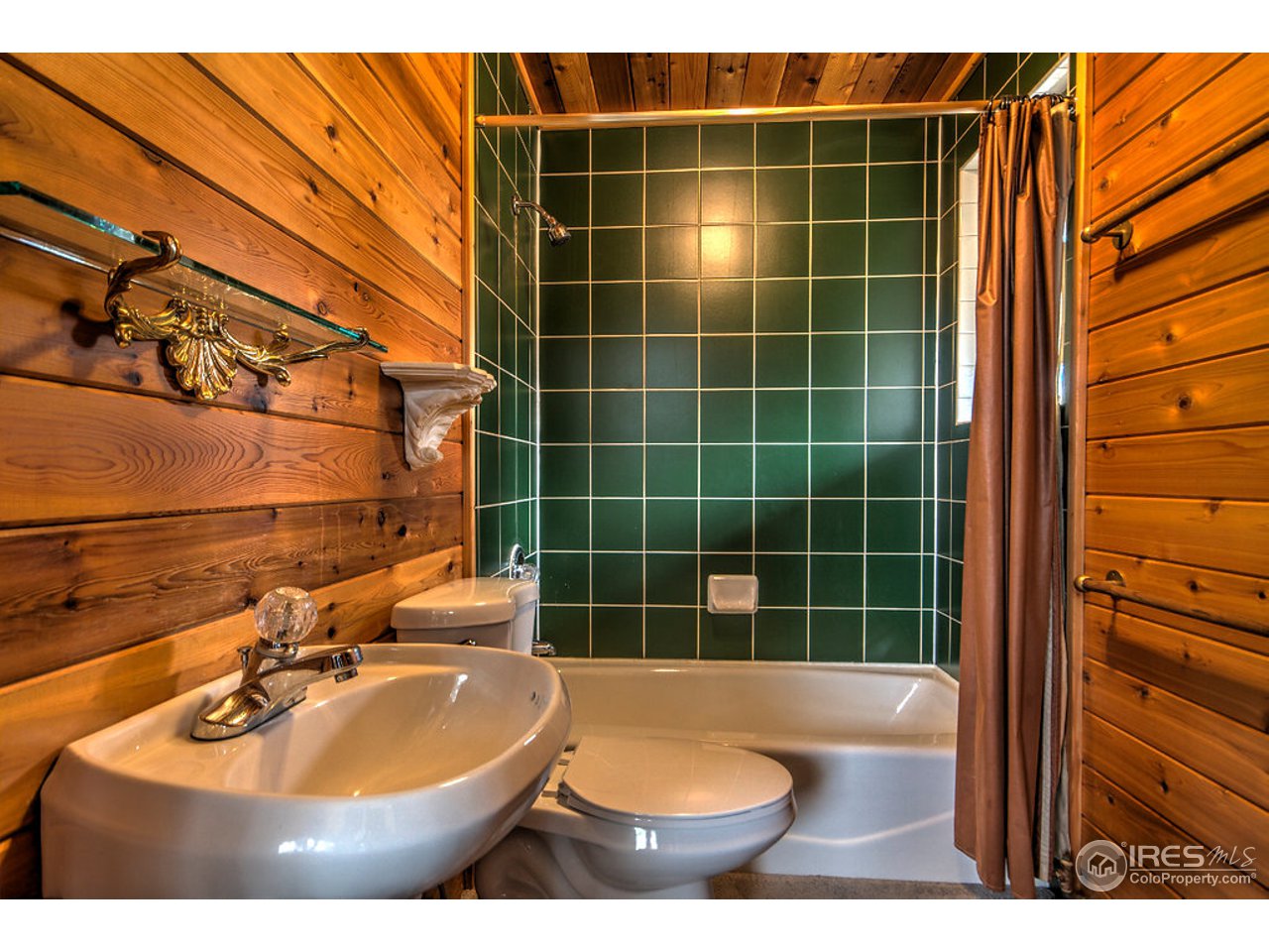238 Valley Road Lyons, CO 80540 - Photo 24 of 28 a bathroom with a sink and a mirror