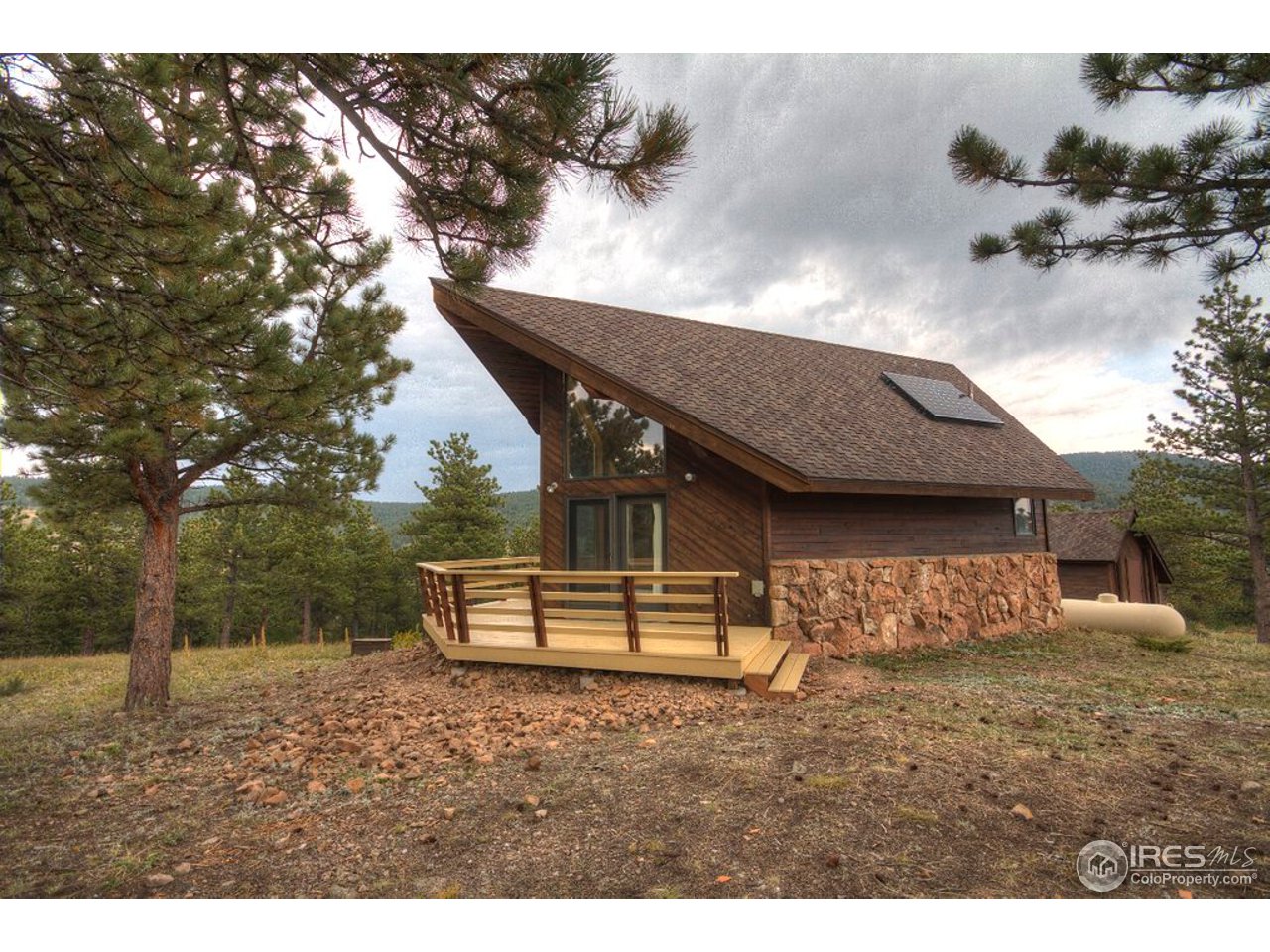 238 Valley Road Lyons, CO 80540 - Photo 26 of 28 a backyard of a house with wooden stairs