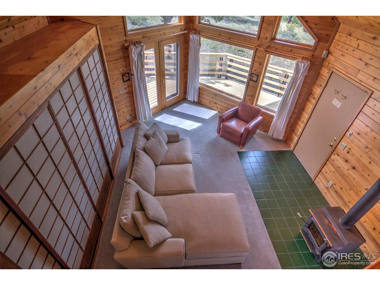238 Valley Road Lyons, CO 80540 - Photo 4 of 28 a view of living room with furniture and floor to ceiling window