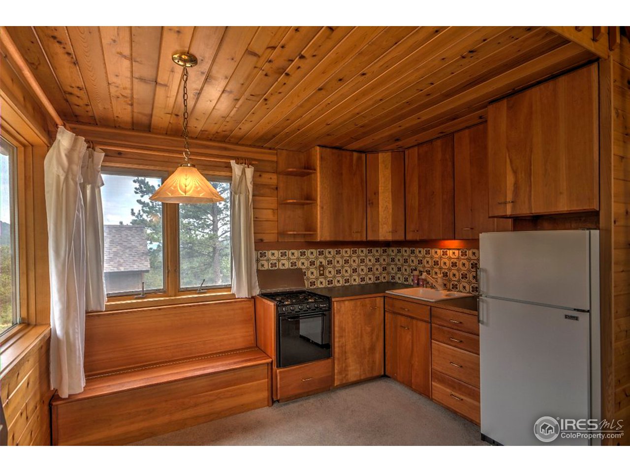 238 Valley Road Lyons, CO 80540 - Photo 5 of 28 a kitchen with stainless steel appliances granite countertop a refrigerator and a sink