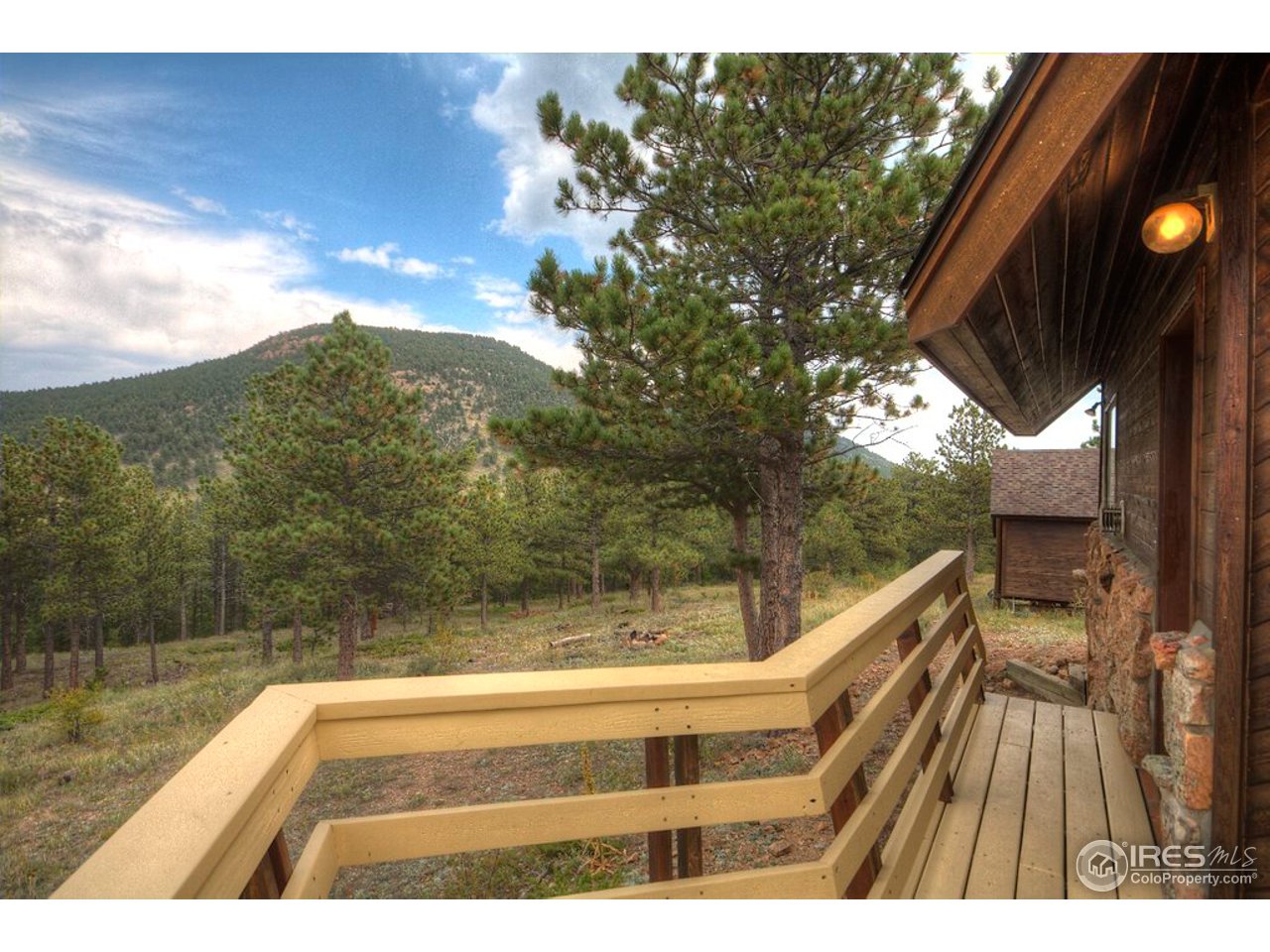 238 Valley Road Lyons, CO 80540 - Photo 8 of 28 a view of balcony with wooden floor and fence