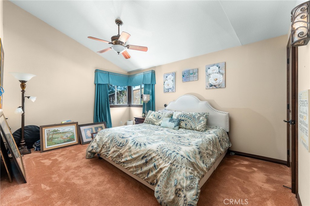 1632 Country Club Drive Redlands, CA 92373 - Photo 23 of 54 a bedroom with a bed and a chandelier