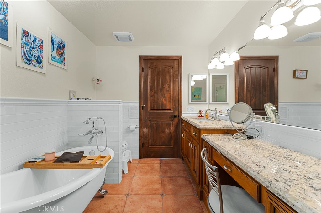 1632 Country Club Drive Redlands, CA 92373 - Photo 26 of 54 a bathroom with a granite countertop sink and a mirror