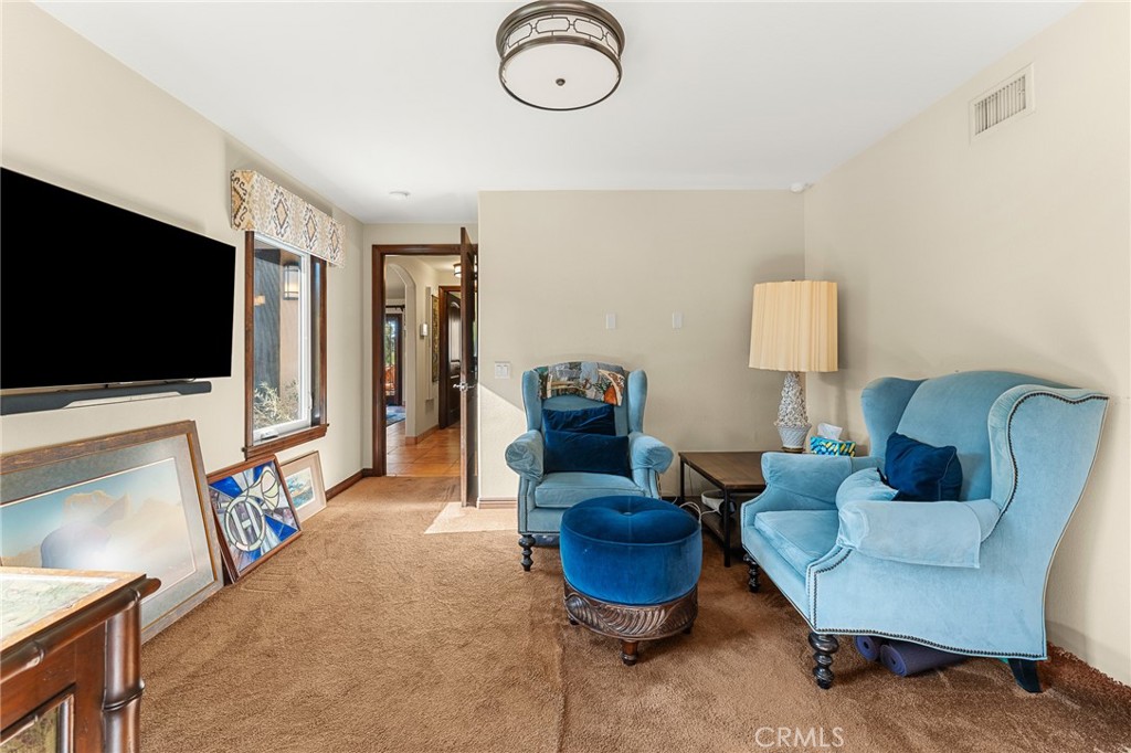 1632 Country Club Drive Redlands, CA 92373 - Photo 28 of 54 a living room with furniture a flat screen tv and a flat screen tv