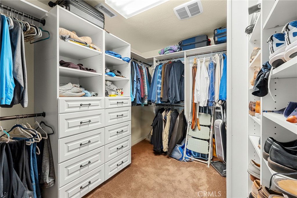 1632 Country Club Drive Redlands, CA 92373 - Photo 29 of 54 a view of walk in closet with clothes and shoes