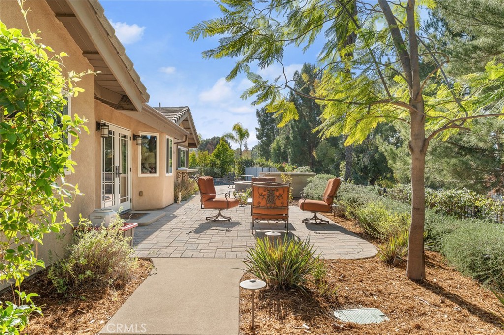 1632 Country Club Drive Redlands, CA 92373 - Photo 37 of 54 a view of a patio with table and chairs and potted plants