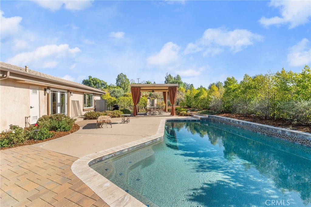 1632 Country Club Drive Redlands, CA 92373 - Photo 43 of 54 a view of a swimming pool with a patio