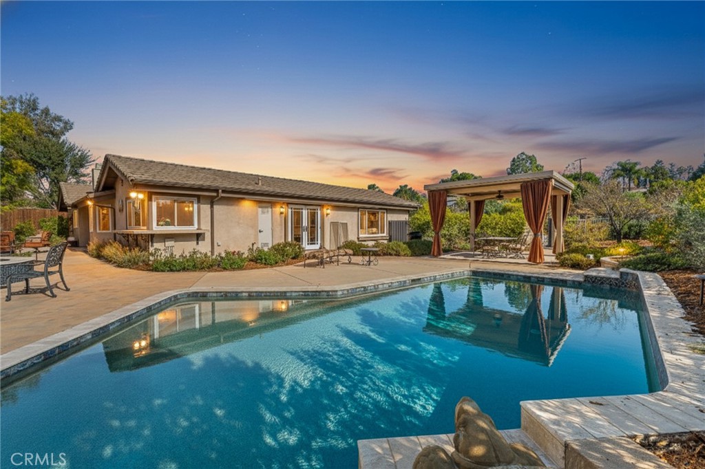 1632 Country Club Drive Redlands, CA 92373 - Photo 47 of 54 a view of a swimming pool with an outdoor seating