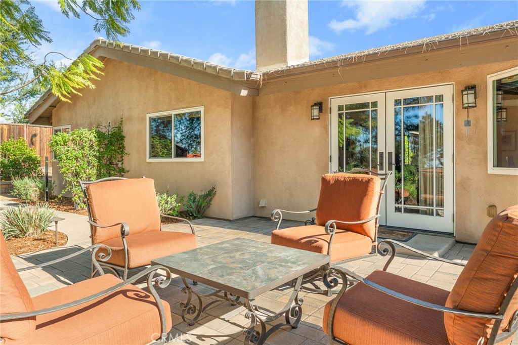 1632 Country Club Drive Redlands, CA 92373 - Photo 48 of 54 a view of a patio with table and chairs and potted plants