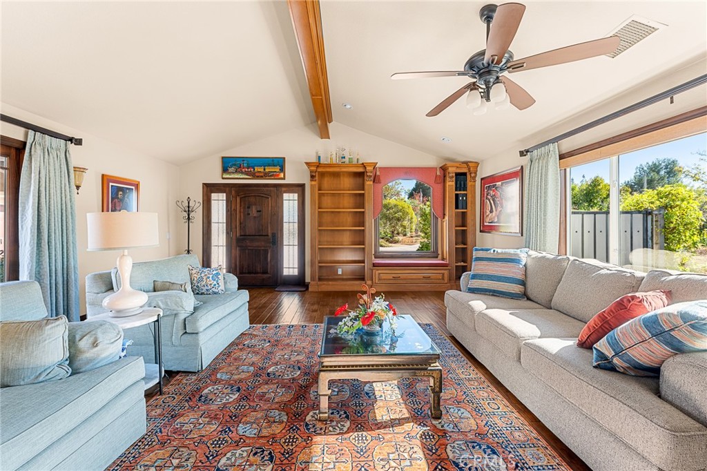 1632 Country Club Drive Redlands, CA 92373 - Photo 6 of 54 Living room looking towards the front door and custom built-in book case.