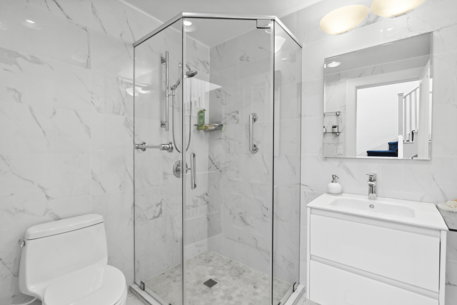 152 East 63rd Street, Unit 2 Manhattan, NY 10065 - Photo 21 of 23 a bathroom with a shower sink vanity and toilet