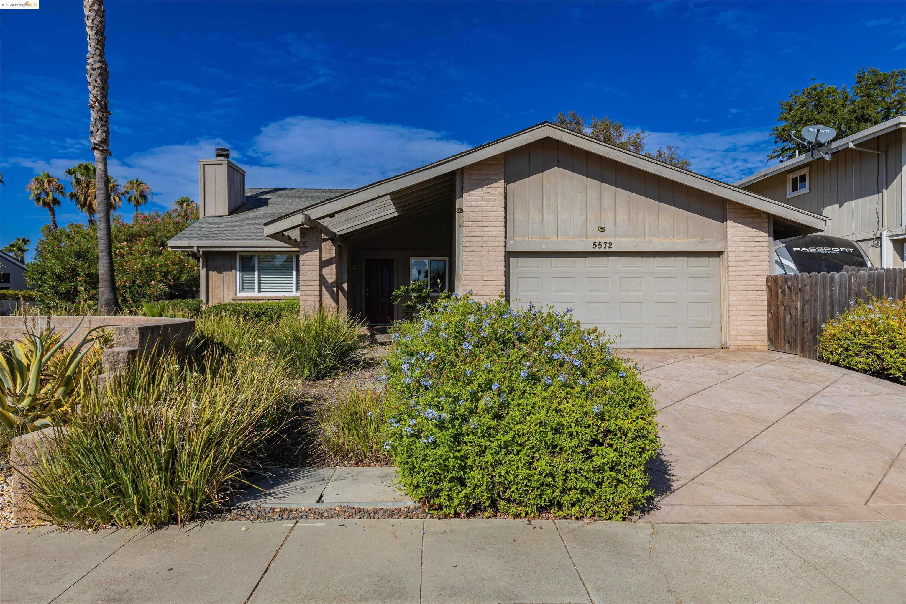 5572 Riverlake Road Discovery Bay, CA 94505 - Photo 1 of 1 a view of a house with a small yard and plants