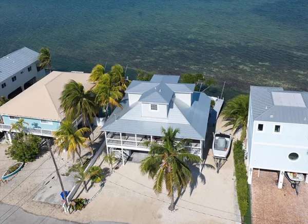 an aerial view of a house with outdoor space