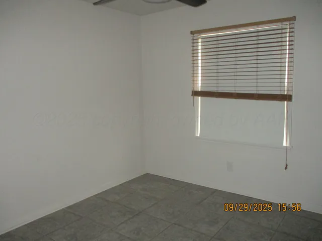 a view of empty room with windows